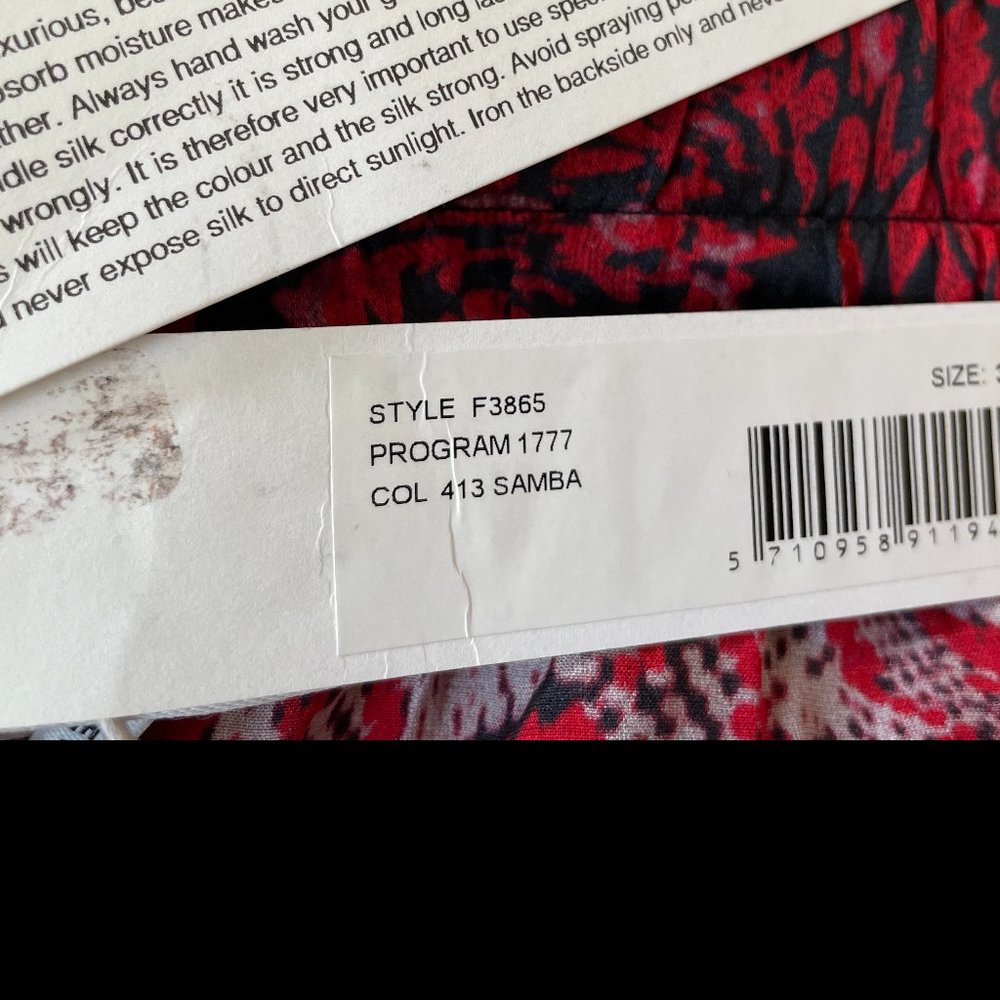 Tie-front printed stretch-silk satin midi skirt from Ganni - Picture 9 of 12